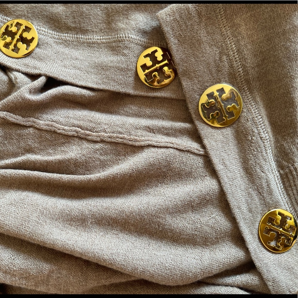 4 Tory Burch large gold Buttons.  Presently attached to a sweater with a hole!
